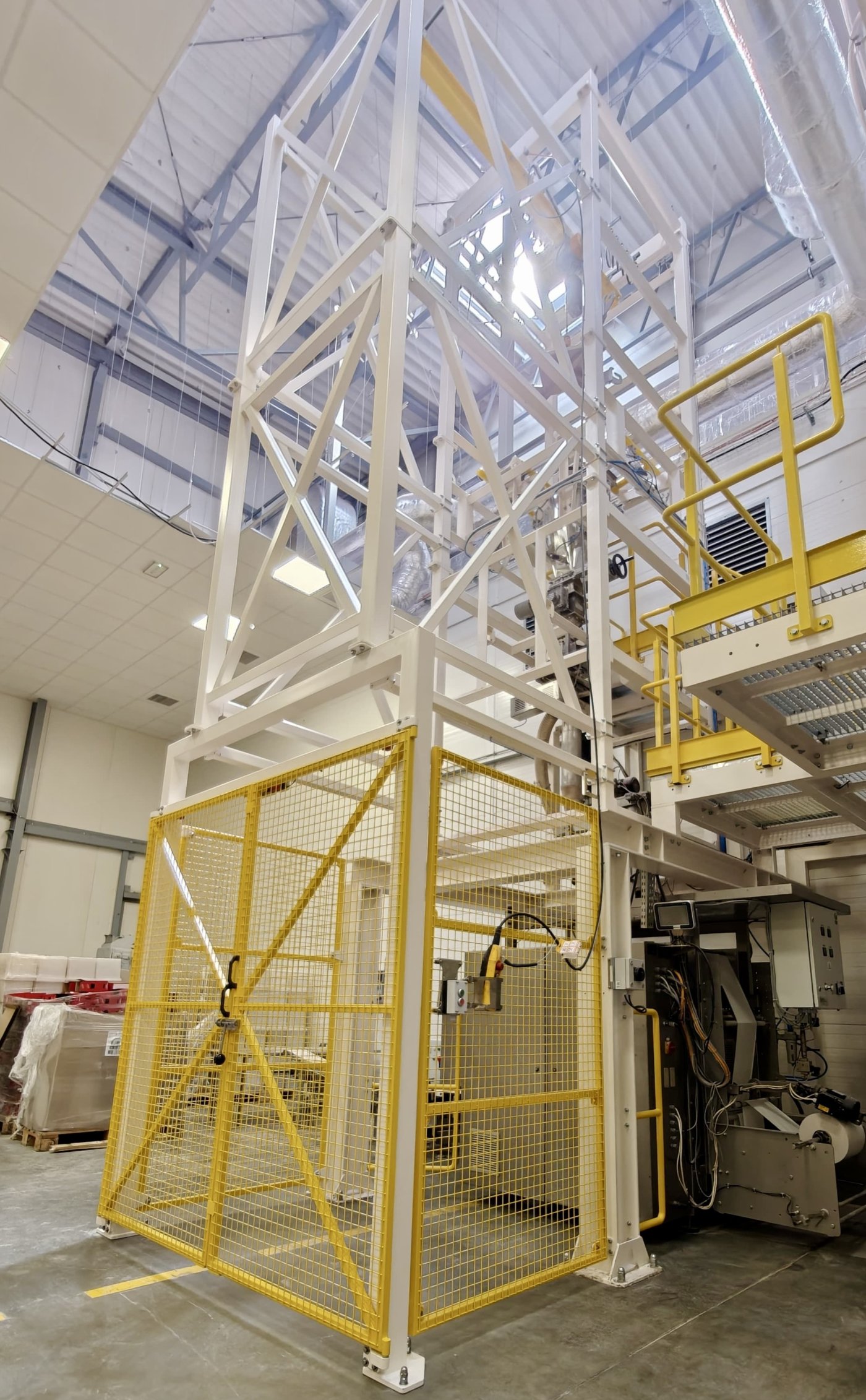A big bag emptying station with optional loading-zone guarding — mesh panels with interlocked doors and controls brought outside